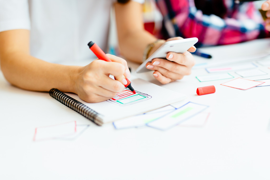 a person writing on a paper