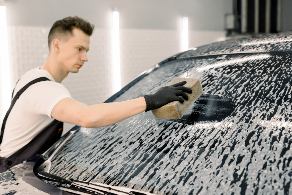 a man cleaning a car
