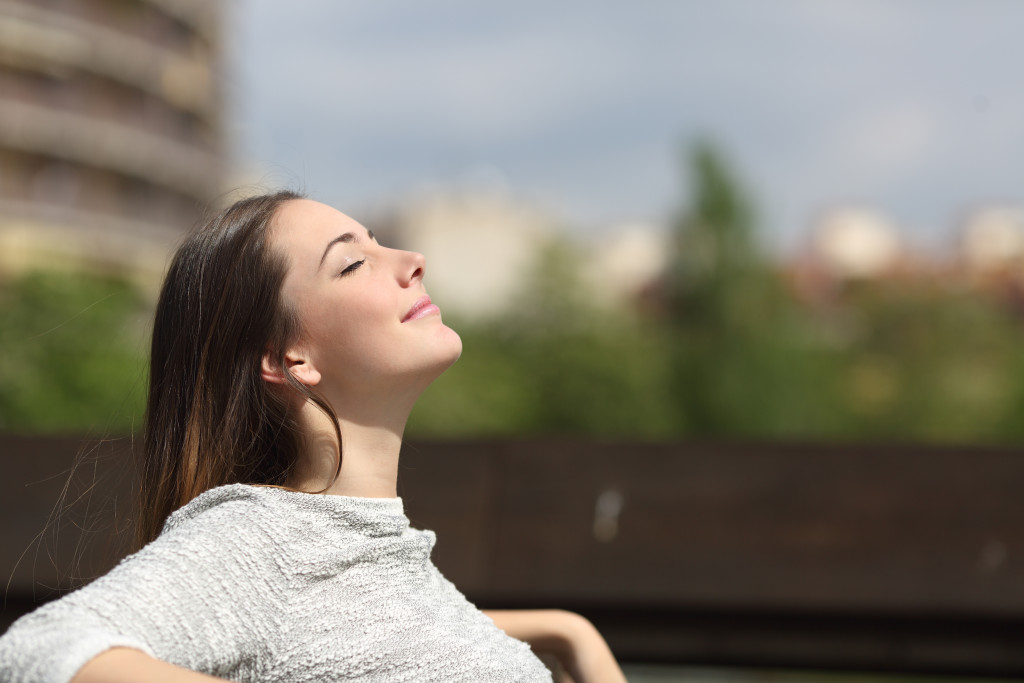 woman resting outdoor under the sun