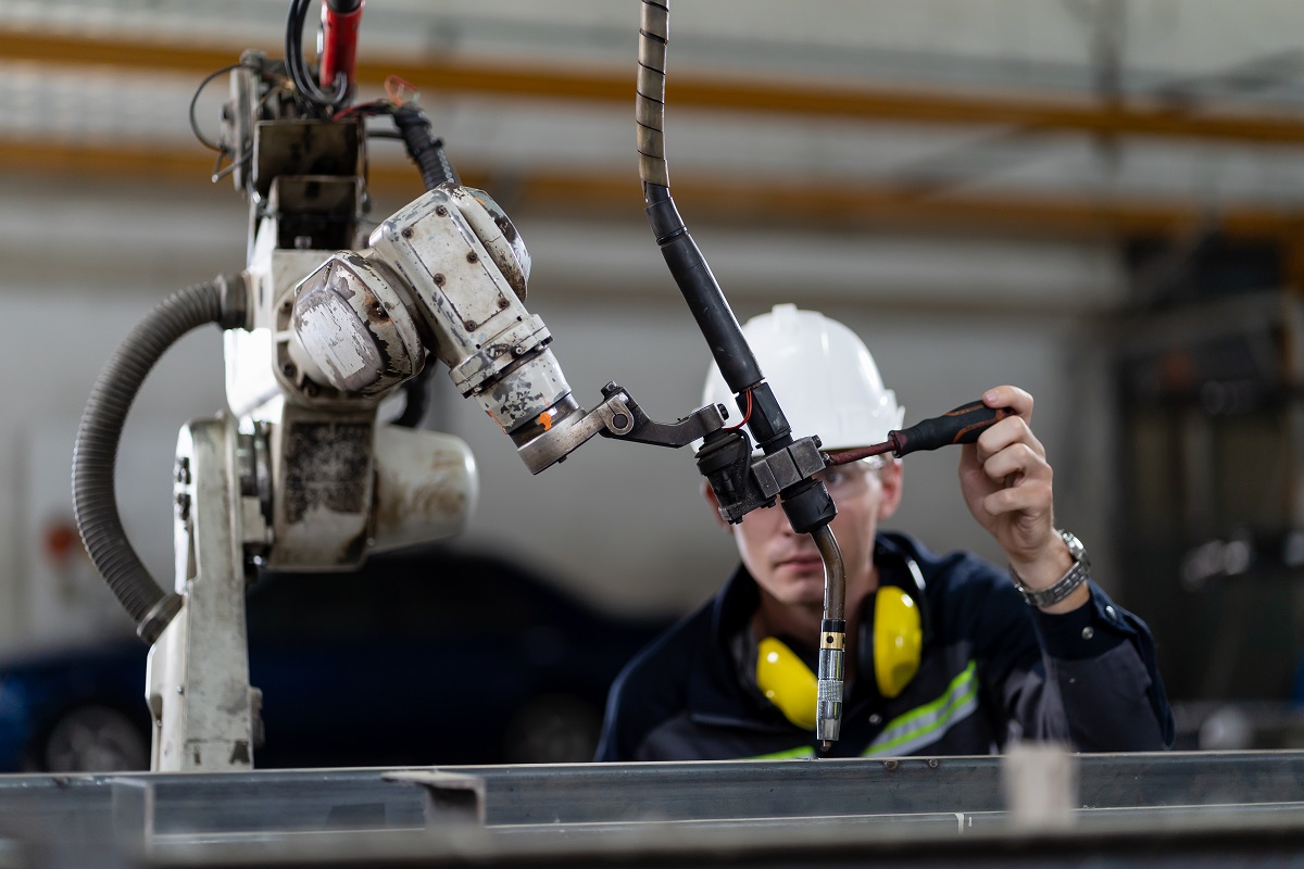 technician repairing robotic system machine